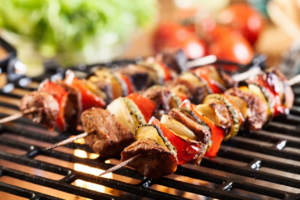 Close up of kabobs roasting on the grill