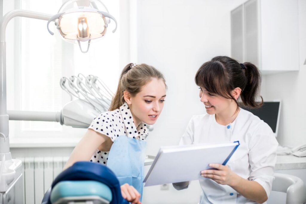 A woman at a smile makeover consultation with her dentist.