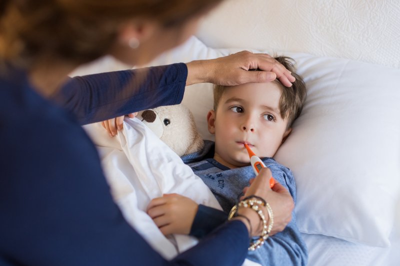 Patient with good oral health helping sick child